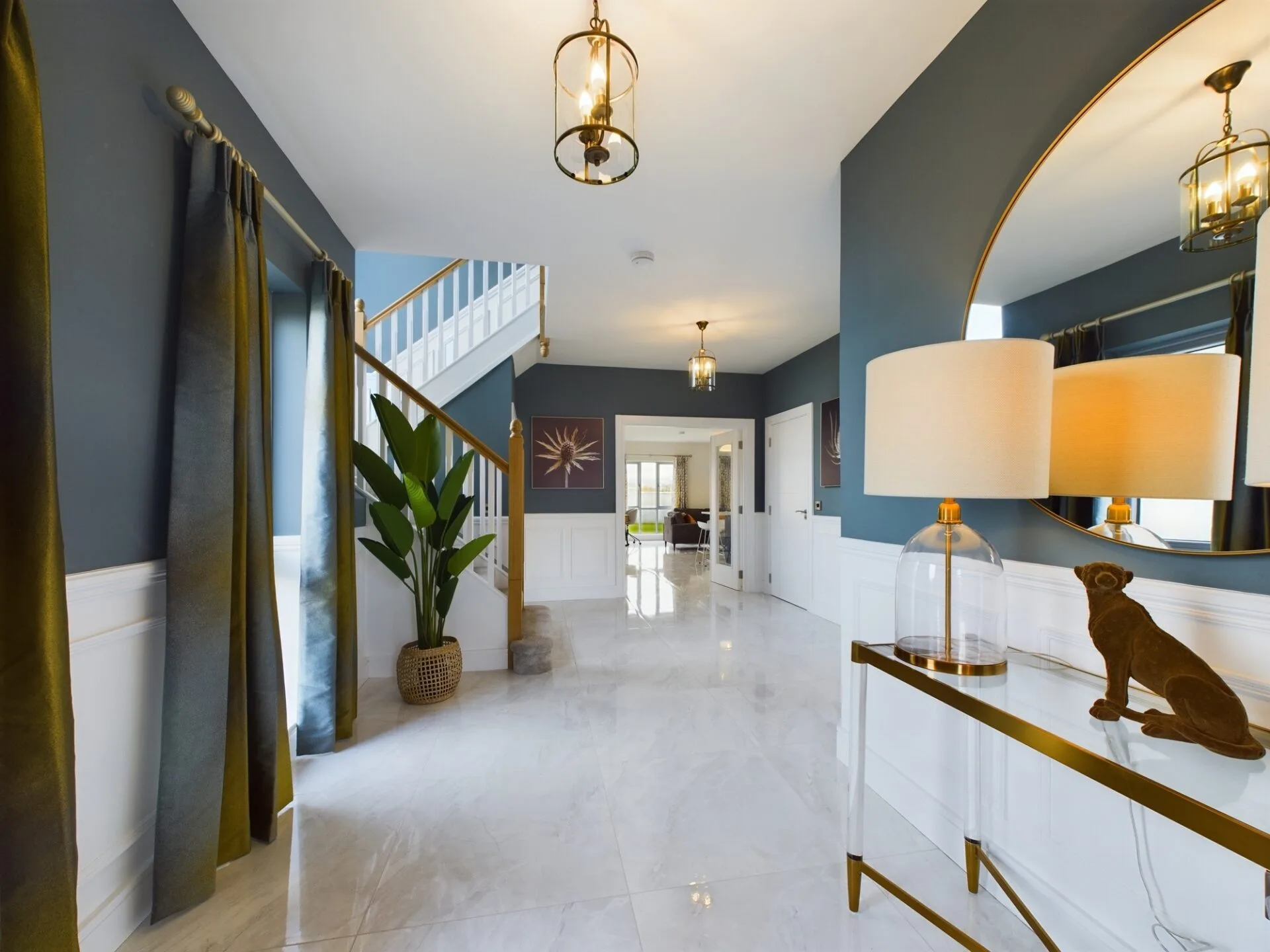 Bright open hallway with modern furniture, plants and artwork