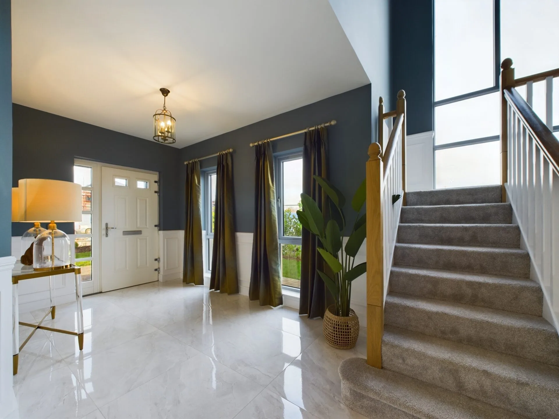 A bright home with blue paintwork, plants and furniture