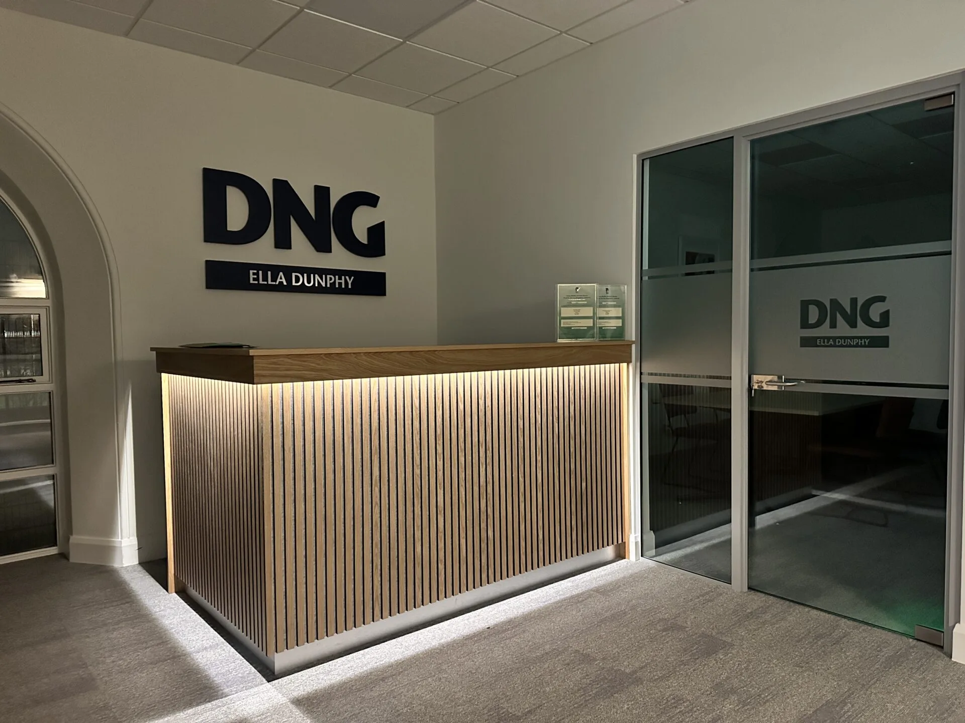 The DNG Ella Dunphy front office with signage and reception.